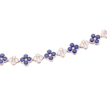 This beautiful 18k white gold bracelet features alternating sapphir...