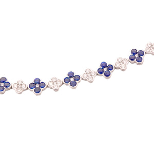 This beautiful 18k white gold bracelet features alternating sapphir...