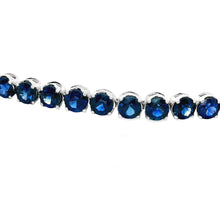 This gorgeous 14k white gold bracelet features sapphires totaling a...