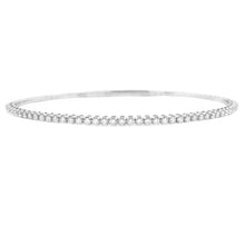 This easy to stack and style 14k gold bangle features round brillia...