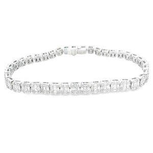 This stunning 18k white gold diamond bracelet features baguette and...