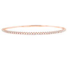 This easy to stack and style 14k gold bangle features round brillia...