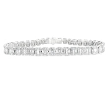This stunning 18k white gold diamond bracelet features baguette and...
