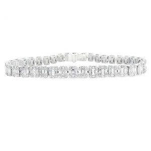 This stunning 18k white gold diamond bracelet features baguette and...
