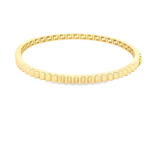 This 14k yellow gold bangle is fluted around the whole bangle.