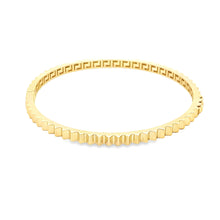 This 14k yellow gold bangle is fluted around the whole bangle.