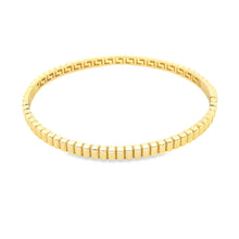 This 14k yellow gold bangle is ribbed around the whole bangle.