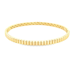 This 14k yellow gold bangle is ribbed around the whole bangle.