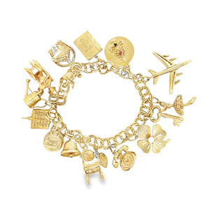 Estate piece: 14k yellow gold charm bracelet with assorted charms. ...