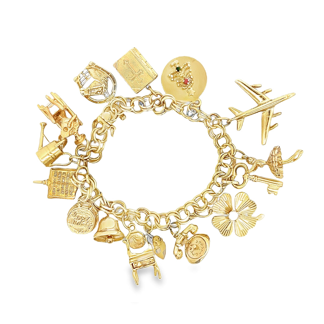 Estate piece: 14k yellow gold charm bracelet with assorted charms. ...