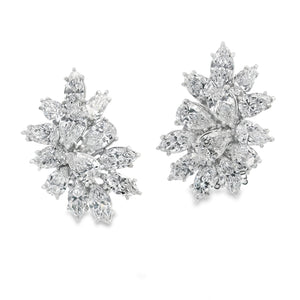 These absolutely stunning platinum earrings features pear shape and...