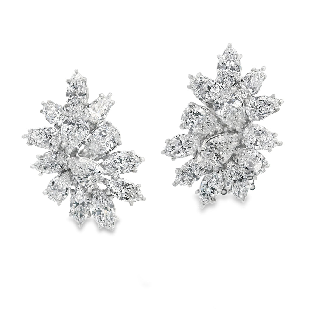 These absolutely stunning platinum earrings features pear shape and...
