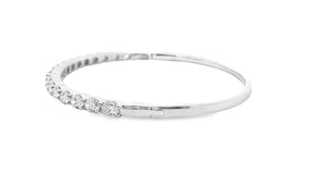This easy to stack and style 18k white gold bangle features 18 oval...