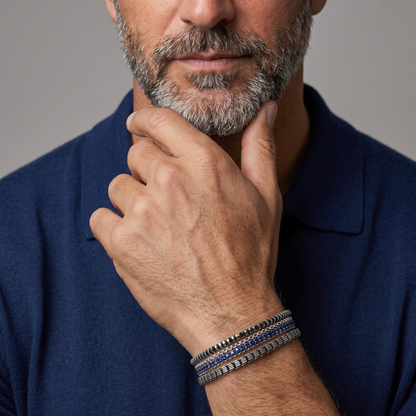 Tateossian men's bracelets stacked on model's wrist