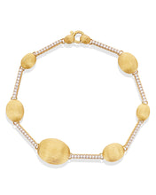 A refined thread of diamonds elegantly combined with Nanis' famous ...