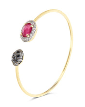 The ruby ​​and the diamonds look for each other along this 18kt gol...