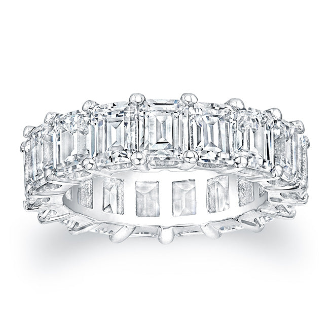 Emerald cut diamonds are set in a continuous circle using shared pr...