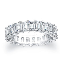 Emerald cut diamonds are set in a continuous circle using shared pr...