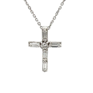 This 18k white gold diamond cross pendant features 5 baguette and 1...