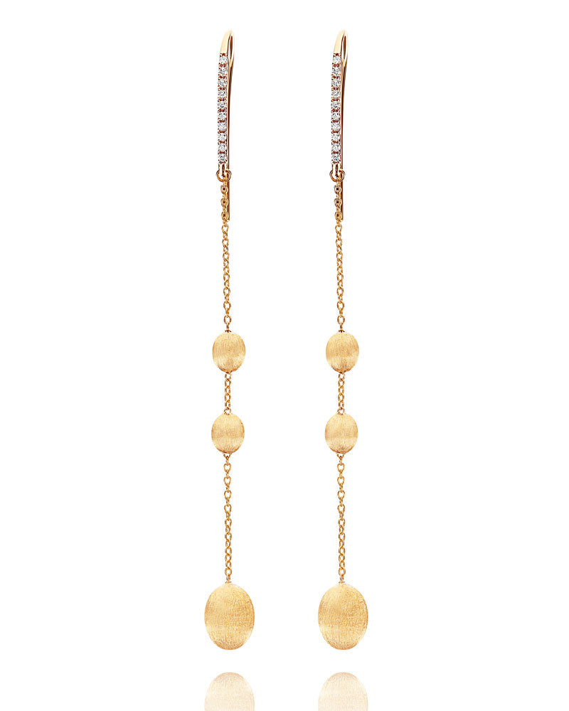 Golden raindrops, these 18 kt gold and diamonds earrings will give ...