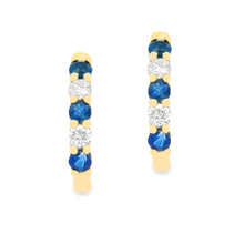 These small 14k yellow gold huggy earrings feature round brilliant ...