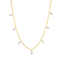 This beautiful 18k yellow gold necklace features 7 marquise cut dia...