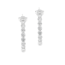 These gorgeous diamond hoops feature 36 round brilliant cut diamond...