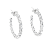 These gorgeous diamond hoops feature 36 round brilliant cut diamond...