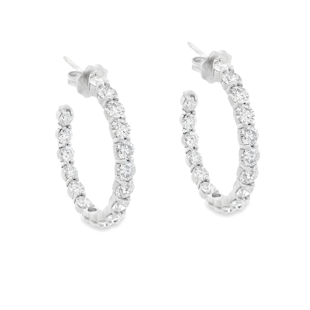 These gorgeous diamond hoops feature 36 round brilliant cut diamond...