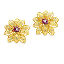 Estate piece: 18k yellow gold diamond and ruby flower earrings
Earr...