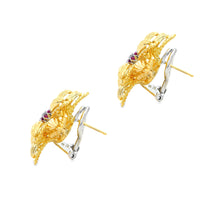 Estate piece: 18k yellow gold diamond and ruby flower earrings
Earr...