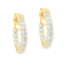 These gorgeous diamond hoops feature 32 oval cut diamonds totaling ...