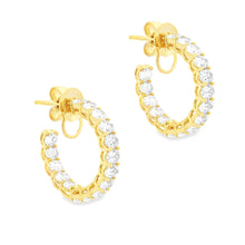 These gorgeous diamond hoops feature 32 oval cut diamonds totaling ...