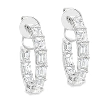 These beautiful diamond hoops feature 22 emerald cut diamonds total...