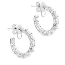 These beautiful diamond hoops feature 22 emerald cut diamonds total...