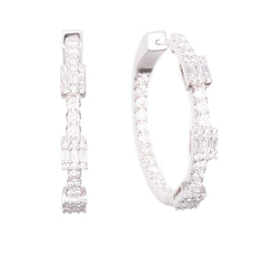 These beautiful diamond hoops feature round brilliant cut and bague...