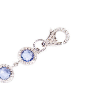 This gorgeous 18k white gold bracelet features sapphires totaling a...