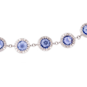 This gorgeous 18k white gold bracelet features sapphires totaling a...