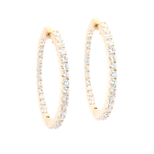 Stylish 18k yellow gold hoops with round brilliant cut diamonds on ...