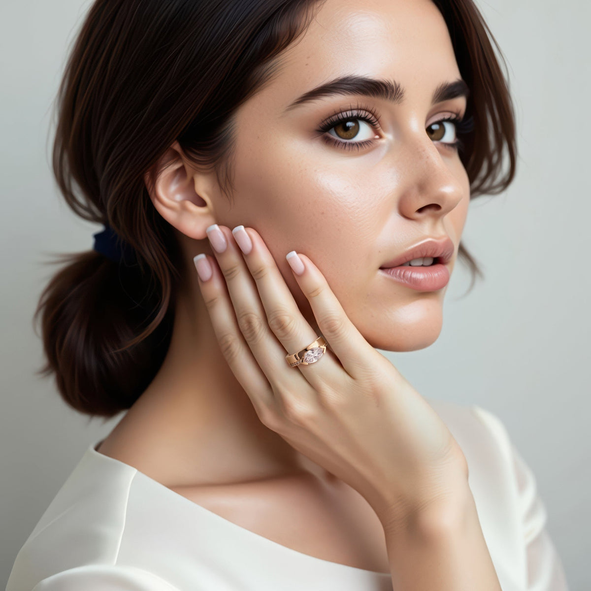 Model wearing a Classique Creations marquise diamond engagement ring