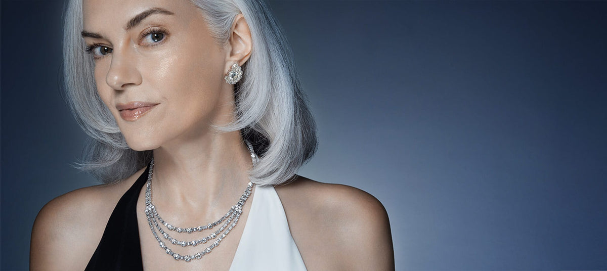 Model wearing a Christopher Designs diamond necklace and earrings