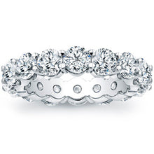 Round brilliant cut diamonds are set in a continuous circle using s...