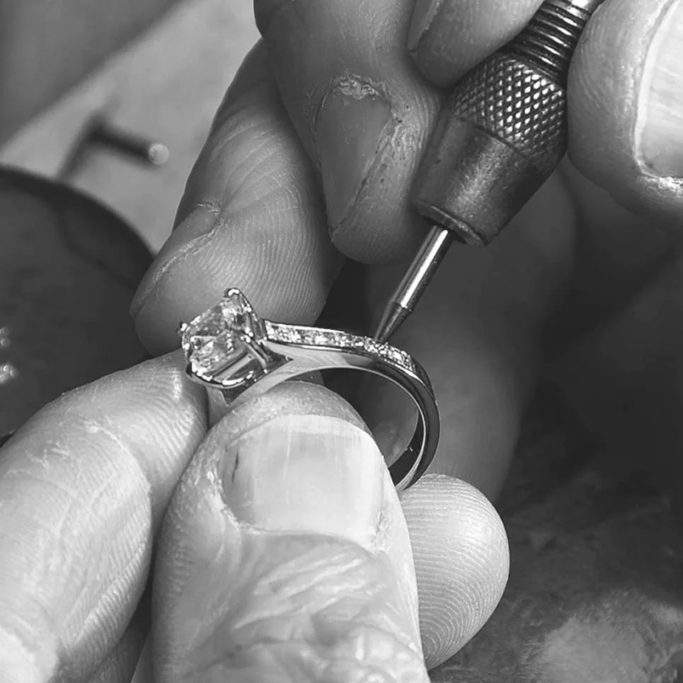 Precision Set artisan finishing an engagement ring