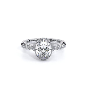 Oval engagement ring with a pave set stardust halo illuminated by r...