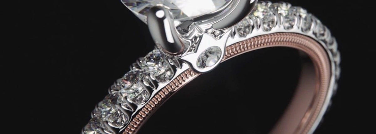 Close-up of a Verragio diamond engagement ring with hand-applied beading