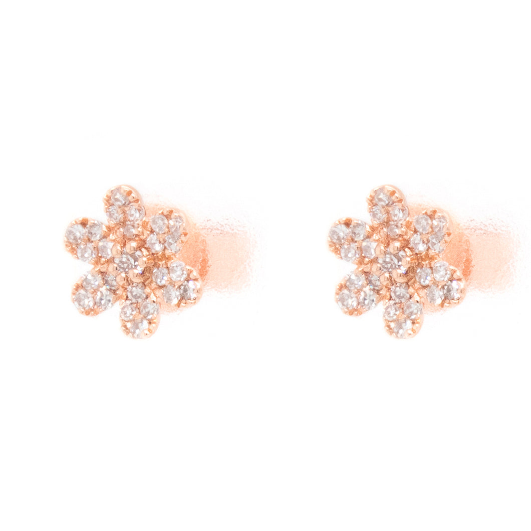 These small studs feature diamonds totaling 0.12ct arranged in flow...