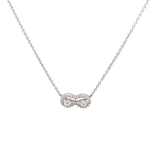 This infinity loop necklace features diamonds totaling 0.21ct. Pend...
