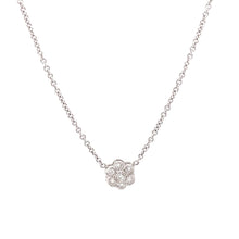 features a small flower pendant with round brilliant cut diamonds t...