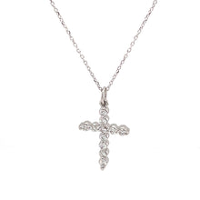 Simple cross pendant on a 14k white gold chain with 11 round brilli...
