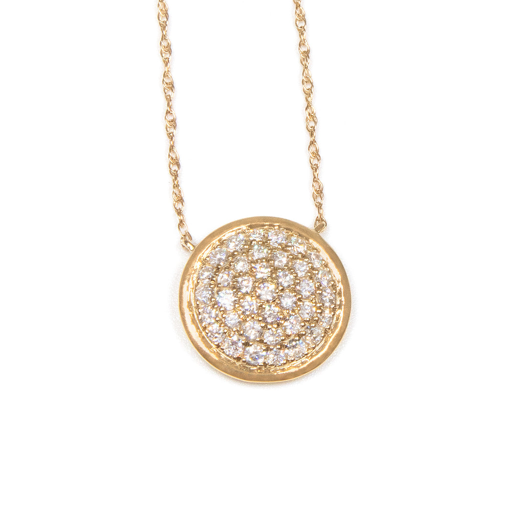 This pendant features pave set round brilliant cut diamonds totalin...